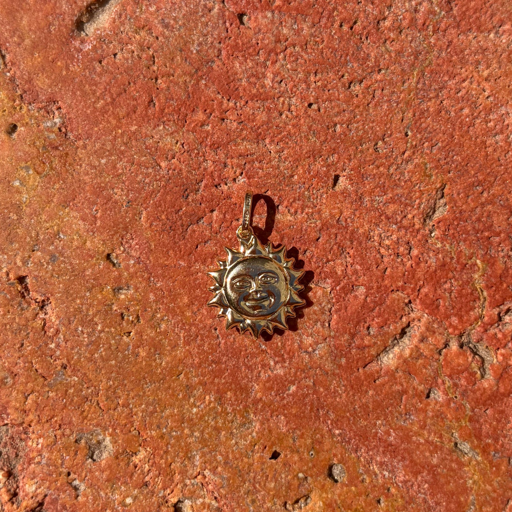 Large sun with face charm