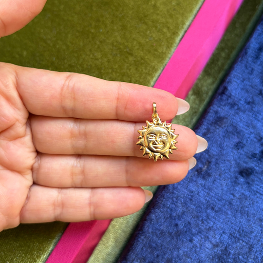 Large sun with face charm